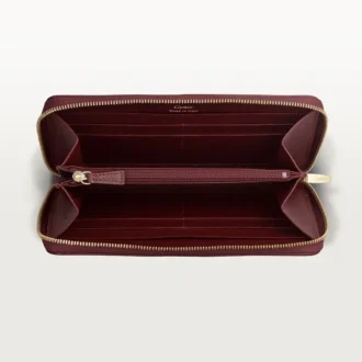 Internationale portemonnee met ritssluiting, Must de Cartier – Bordeauxrood kalfsleer, gouden afwerking – Cartier