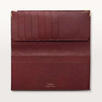 Internationale portemonnee met zijvouwen, Must de Cartier – Bordeauxrood kalfsleer, gouden afwerking – Cartier