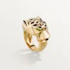 Panthere De Cartier-ring – geelgoud, lak, tsavorietgranaat, onyx – Cartier
