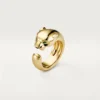 Panthere De Cartier-ring – geelgoud, onyx, tsavoriet-granaat – Cartier
