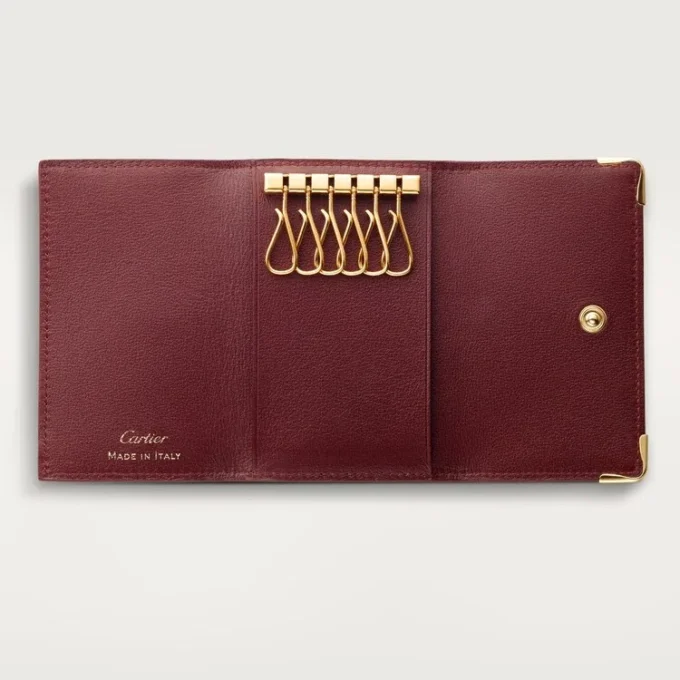 Sleutelhanger met 6 sleutels, Must de Cartier – Bordeauxrood kalfsleer, gouden afwerking – Cartier